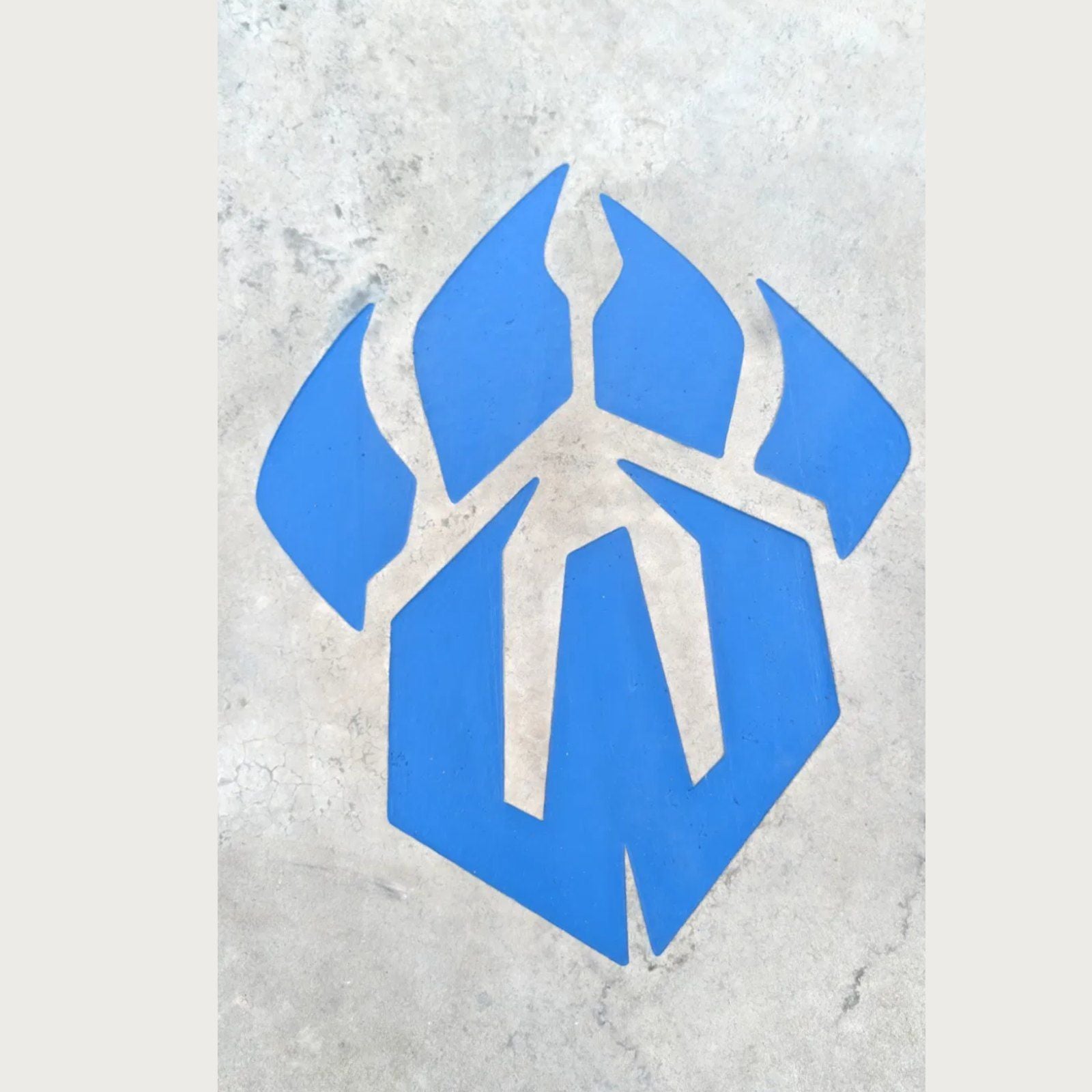 Engraved and color-filled brand mark in finished concrete